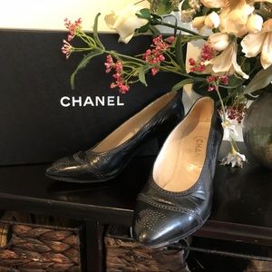 Designer “CHANEL” classic black pumps.
